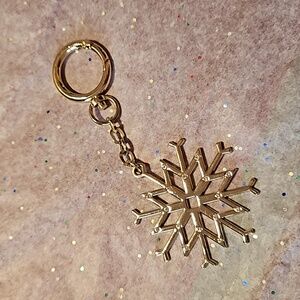 Goldtone snowflake and crystal bag clip